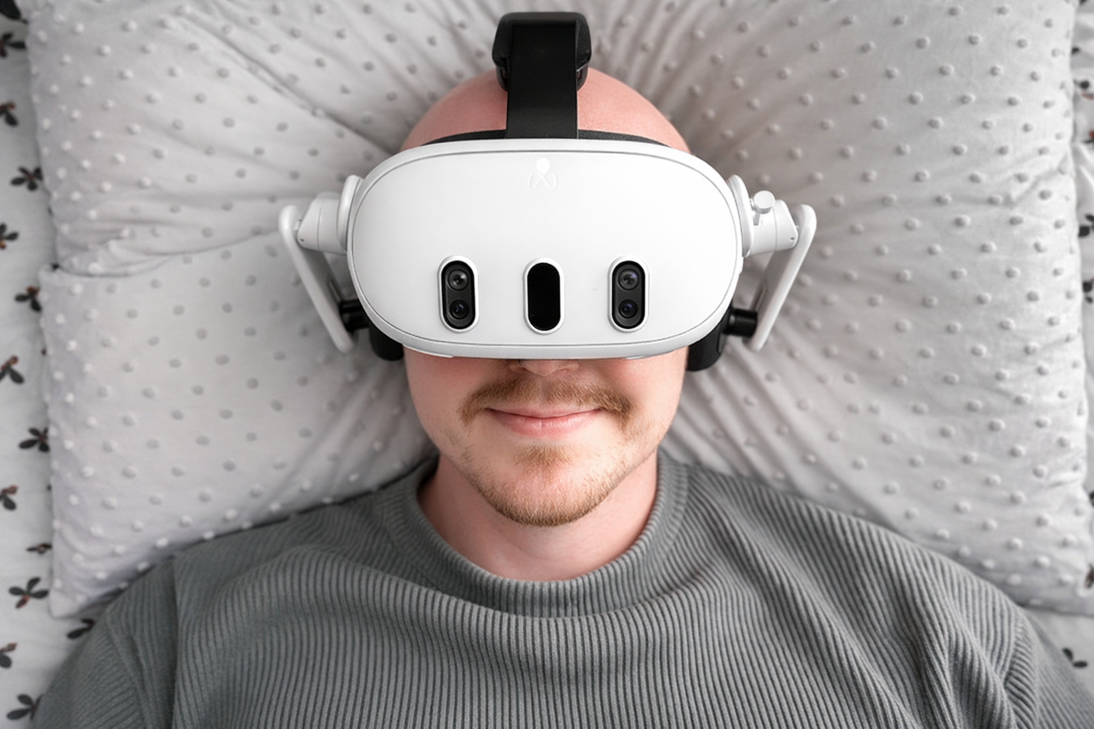 man with vr headset on bed