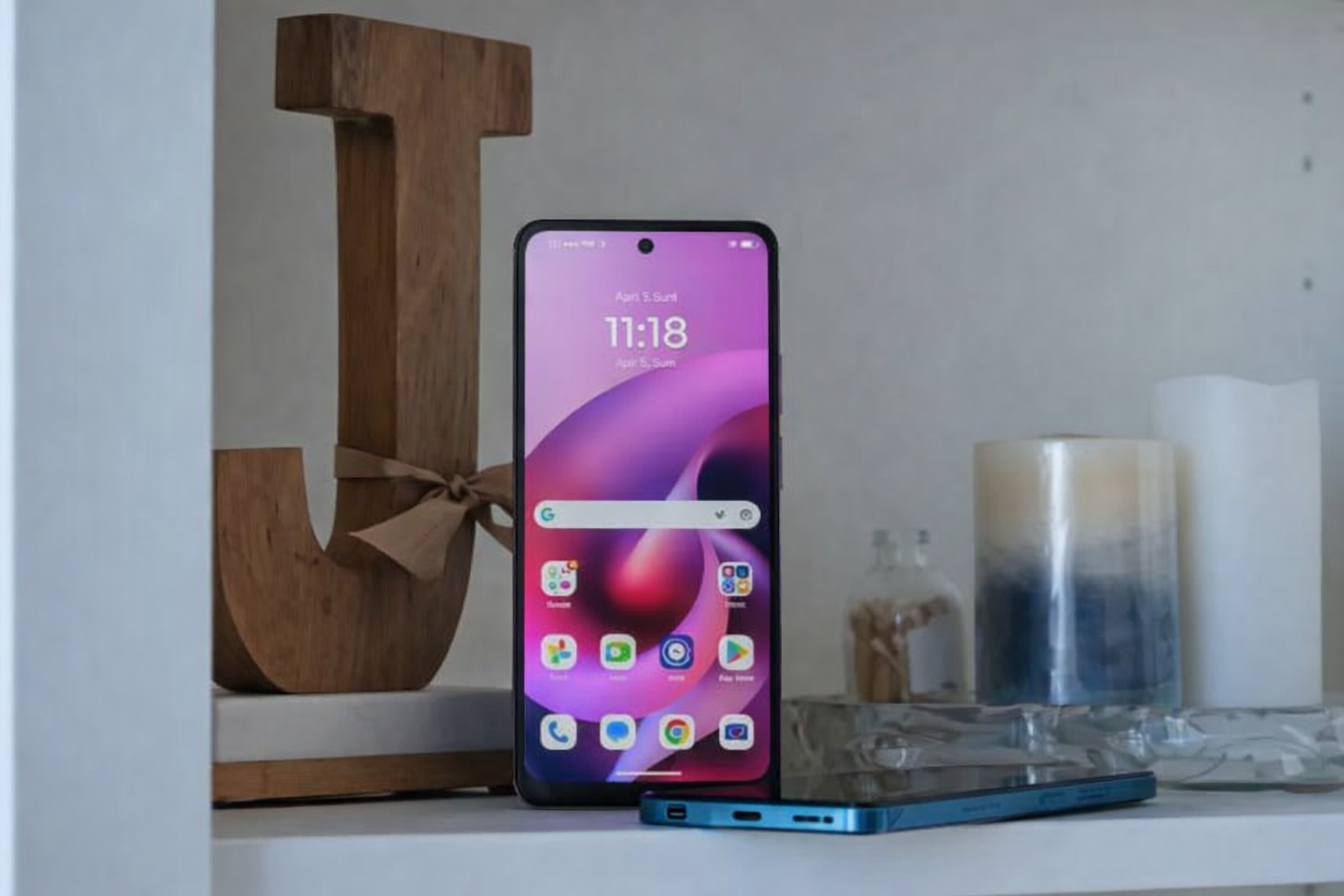 modern phone with wooden letter 'j'