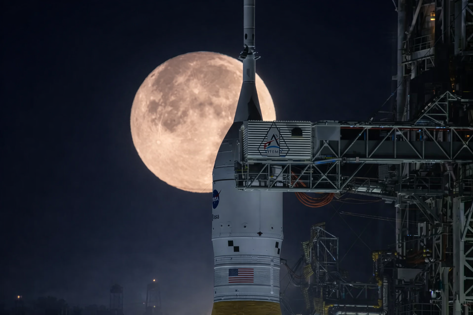 rocket and moon at launchpad