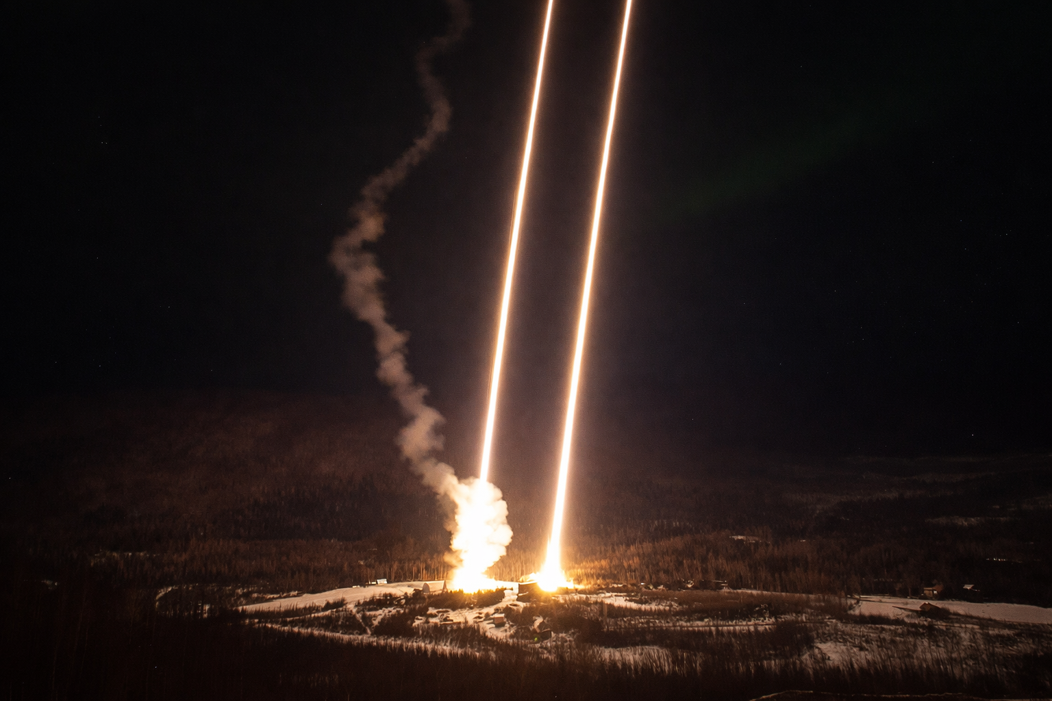 simultaneous rocket launch in winter night