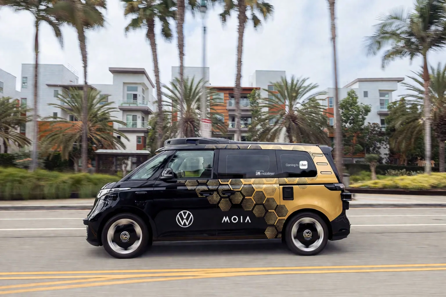 autonomous van in coastal city scene