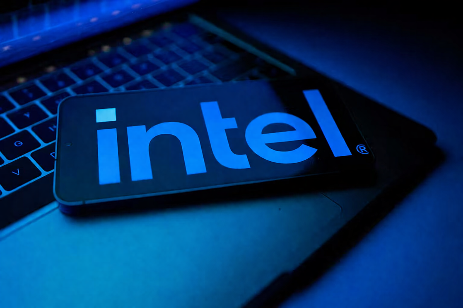 tech still life with glowing intel logo
